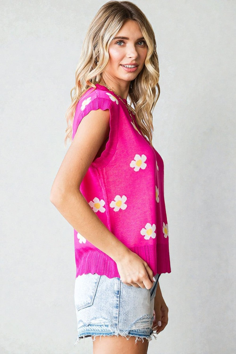 Pull sans manches à imprimé marguerites en fuchsia