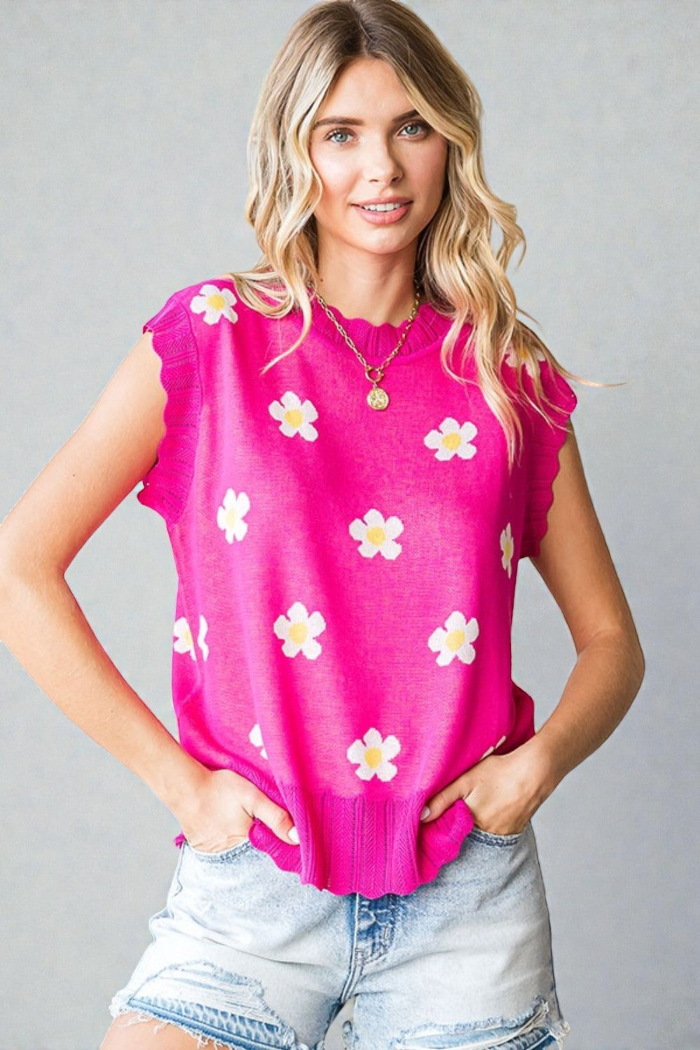 Pull sans manches à imprimé marguerites en fuchsia