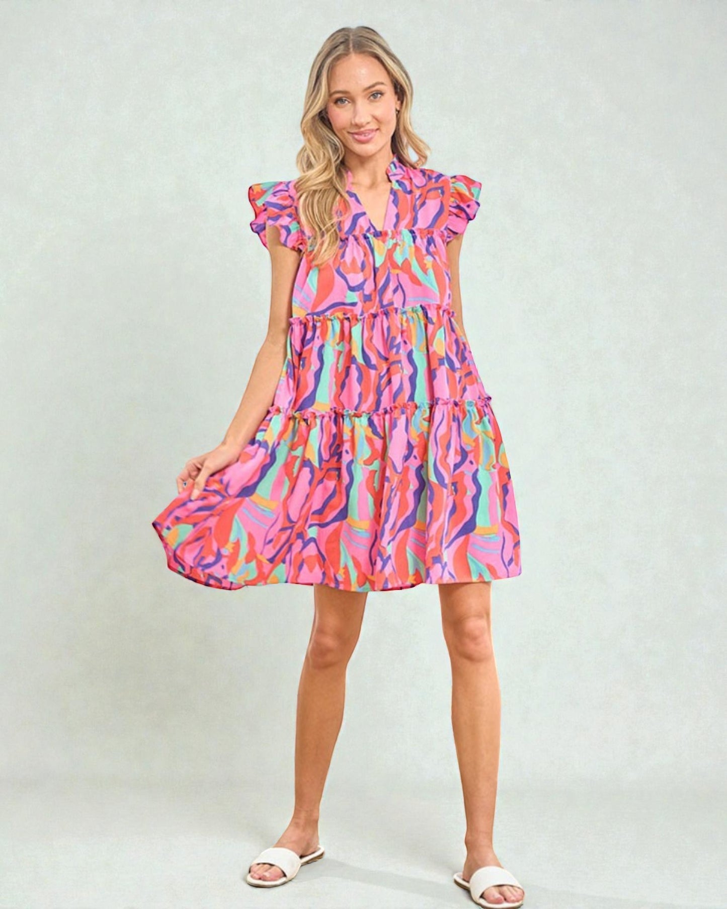 Woman wearing a colorful dress with a white background