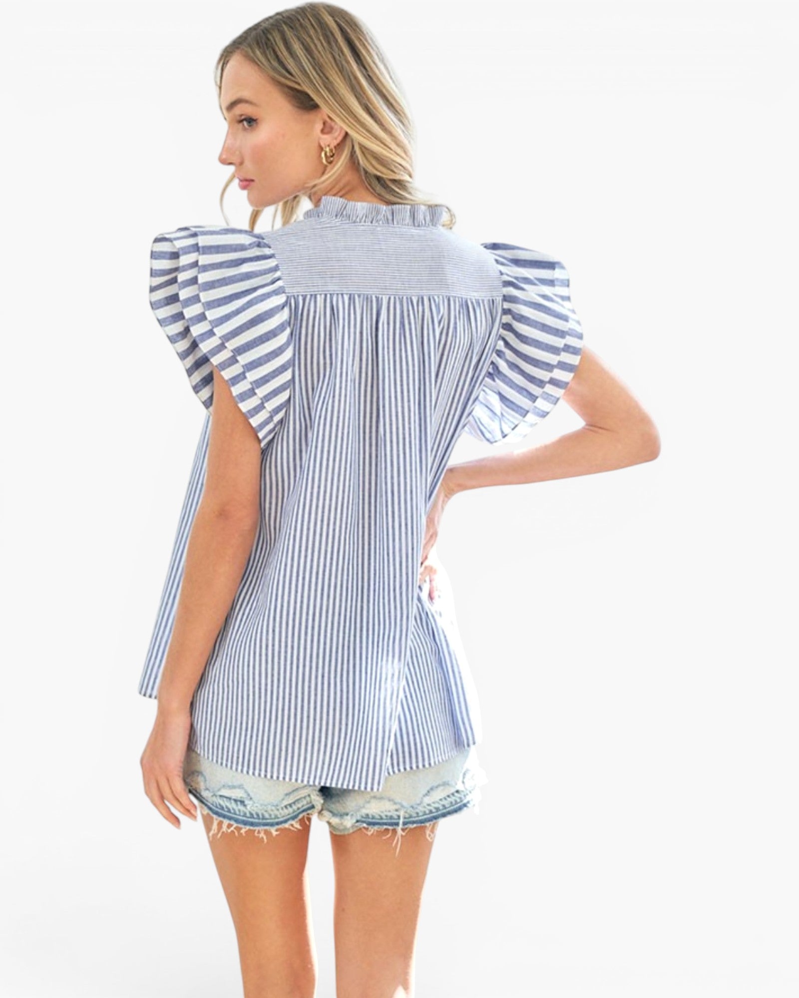 A woman modeling a blue and white vertically striped blouse with ruffled flutter sleeves, shown from the back against a plain white studio background.