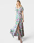 Woman wearing a colorful floral dress on a white background