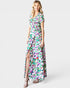 Woman wearing a colorful floral dress on a white background
