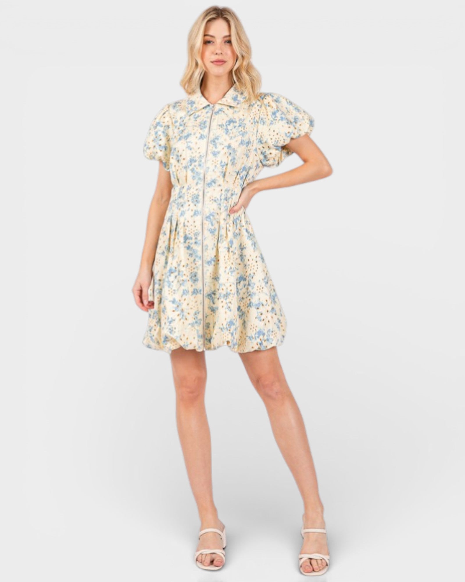 Woman wearing a floral dress on a white background