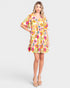 Woman wearing a floral dress on a white background