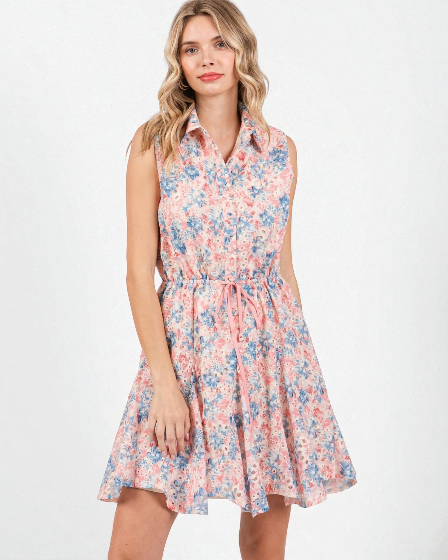 Woman wearing a floral dress on a white background