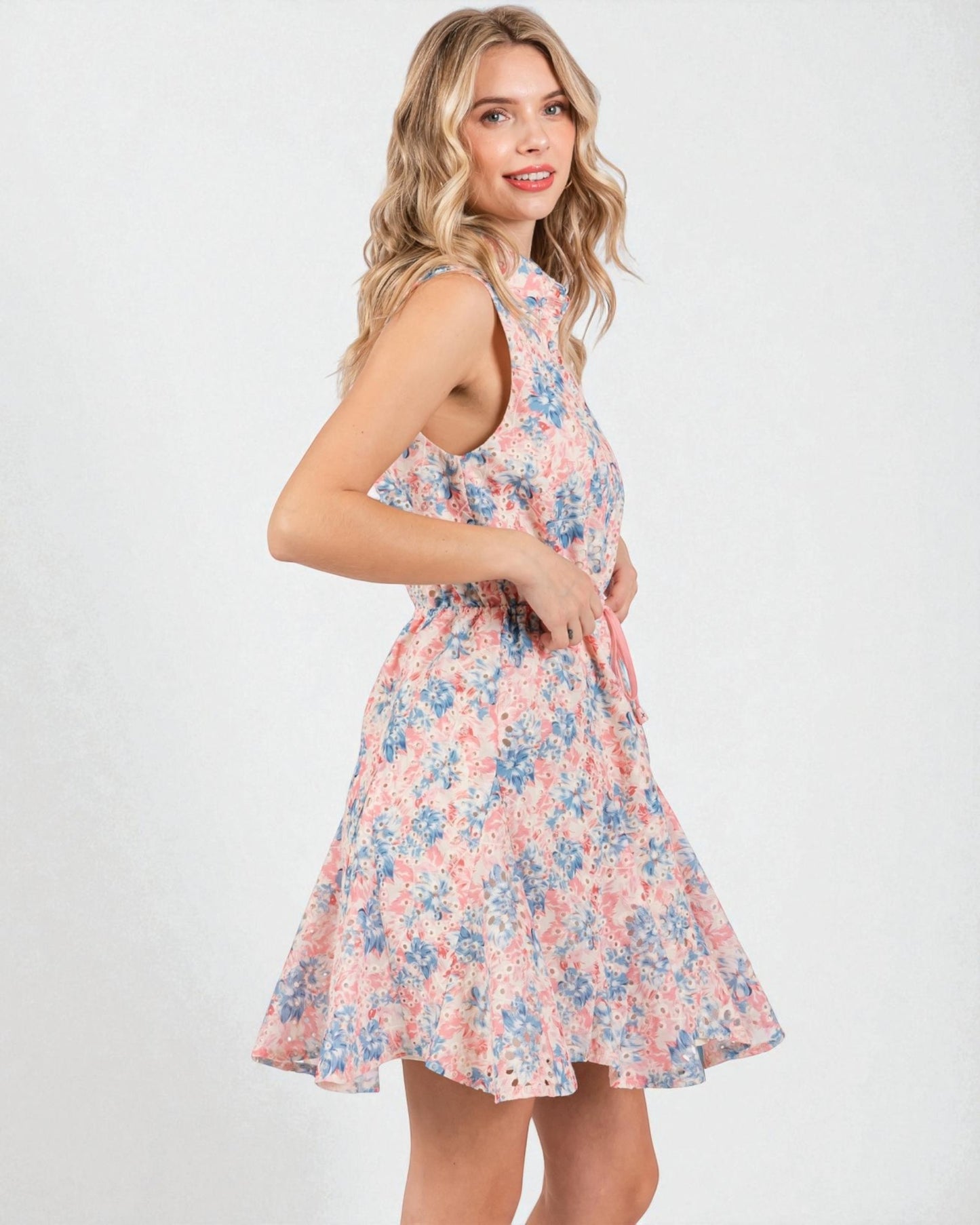 Woman wearing a floral dress on a white background