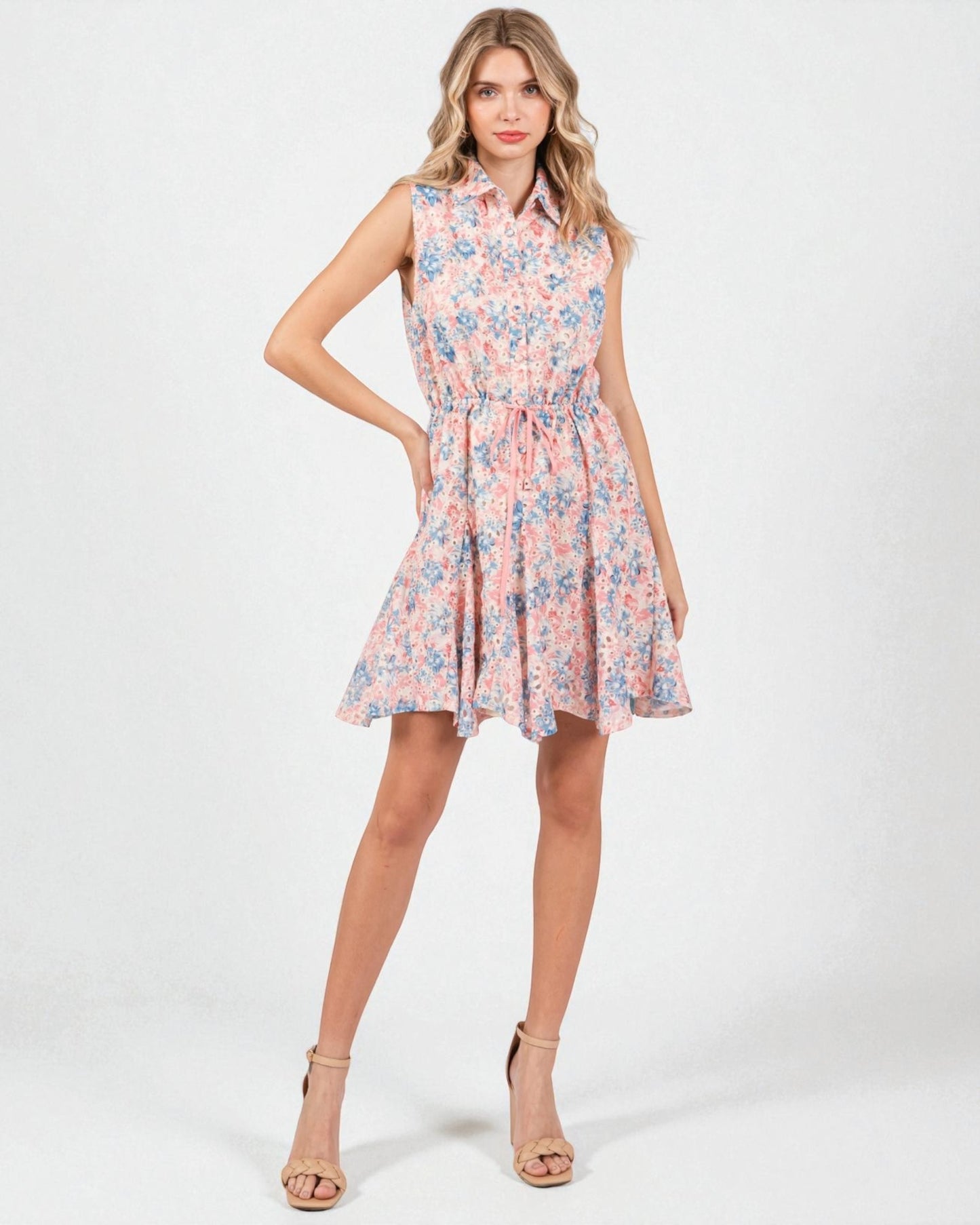 Woman wearing a floral dress on a white background