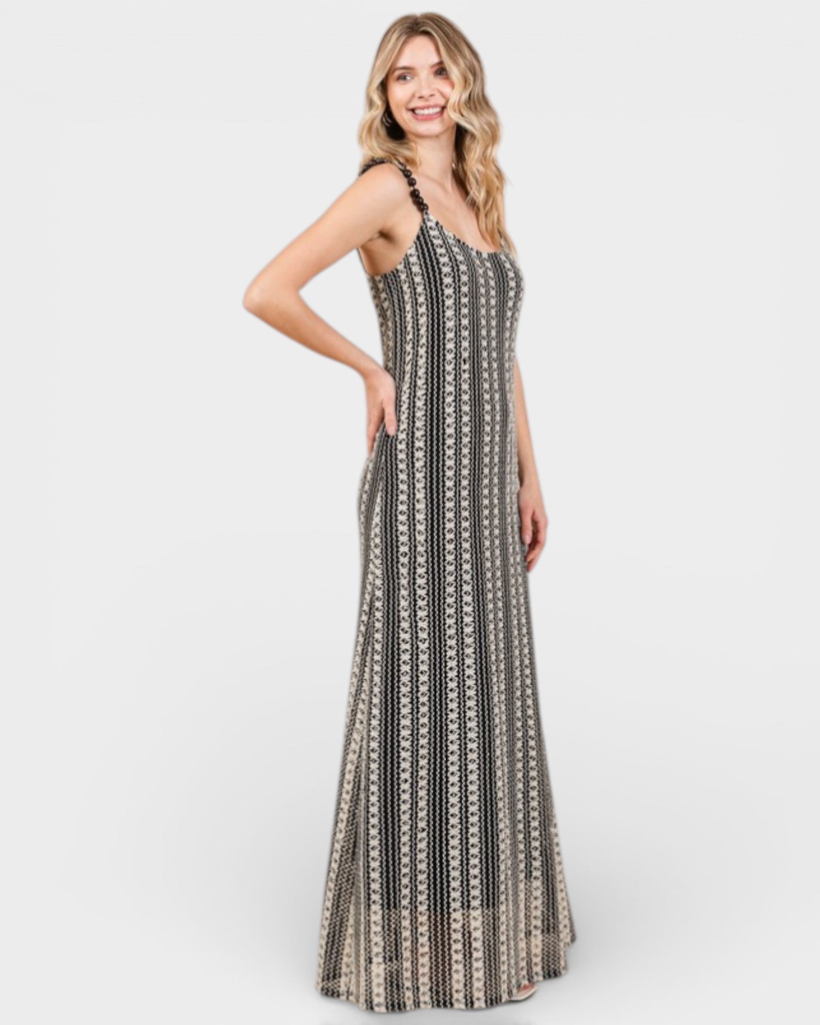 Woman wearing a patterned dress on a white background