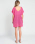 Woman wearing a pink dress on a white background