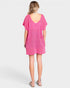 Woman wearing a pink dress on a white background