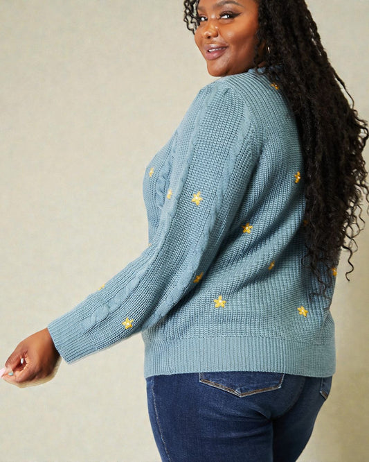 Cárdigan de punto trenzado con bordado floral en color turquesa