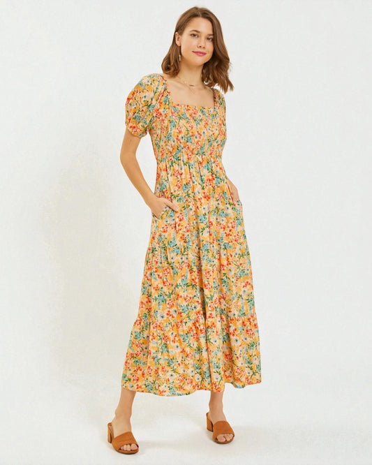 Woman wearing a floral dress on a white background