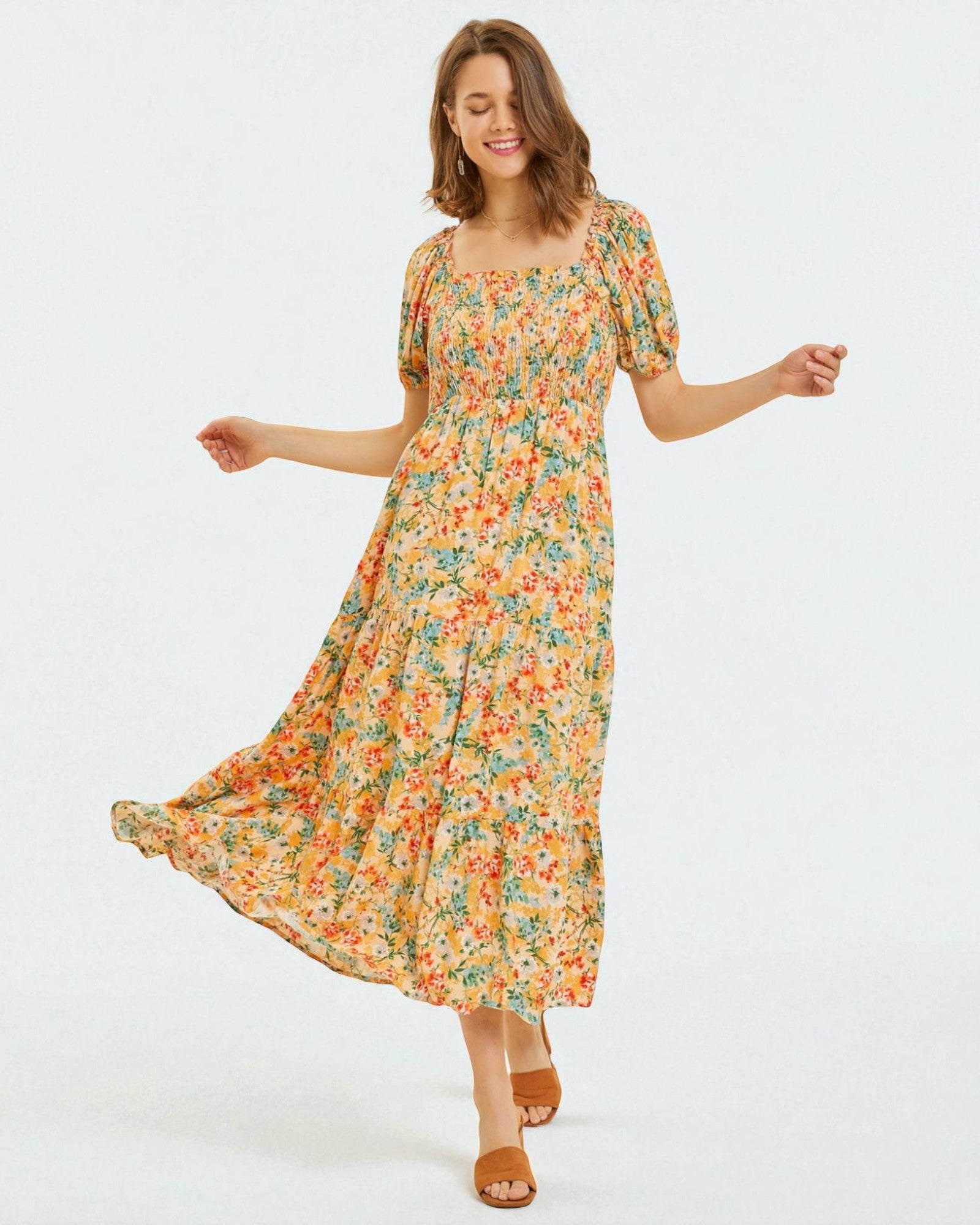 Woman wearing a floral dress on a white background