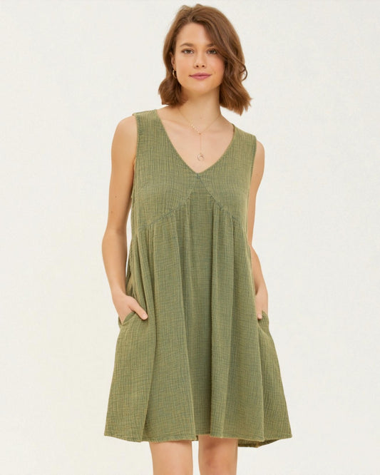 Woman wearing a green checkered dress on a white background