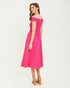 Woman wearing a pink off-shoulder dress on a white background