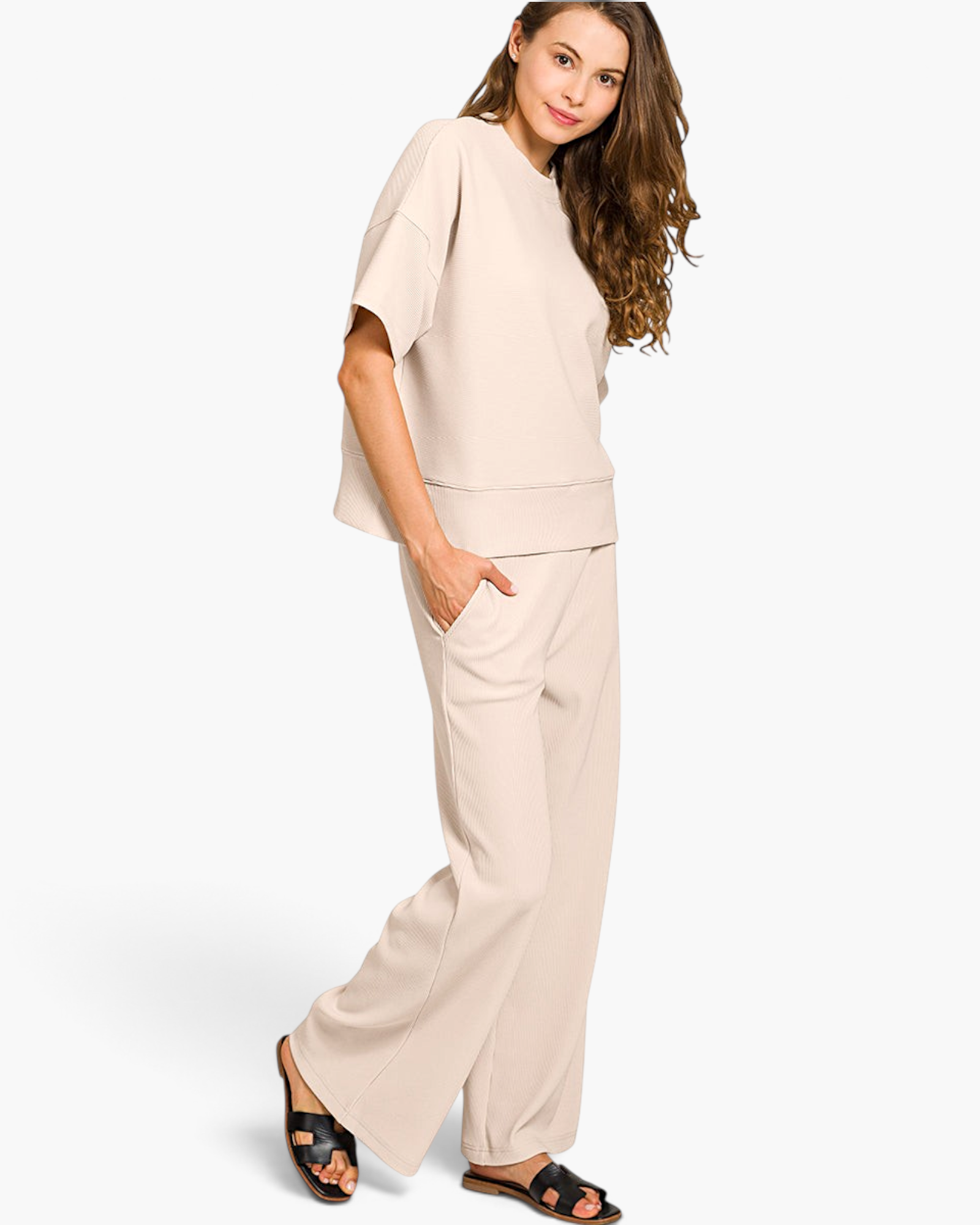 Beach Rose Co. beige ribbed two-piece set with a round neck tee and wide-leg pants worn by a model.