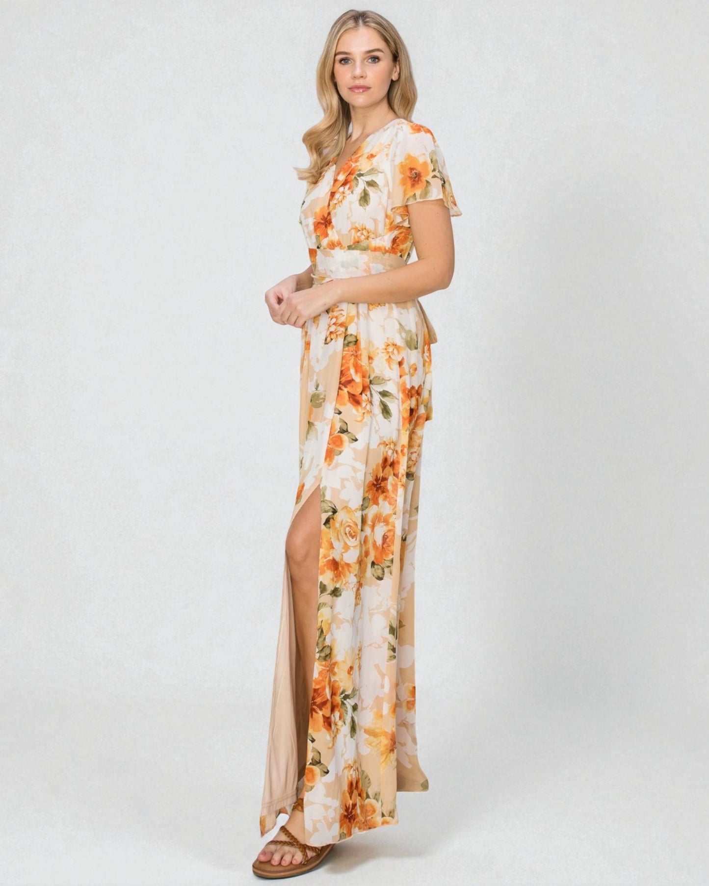 Woman wearing a floral dress with a white background