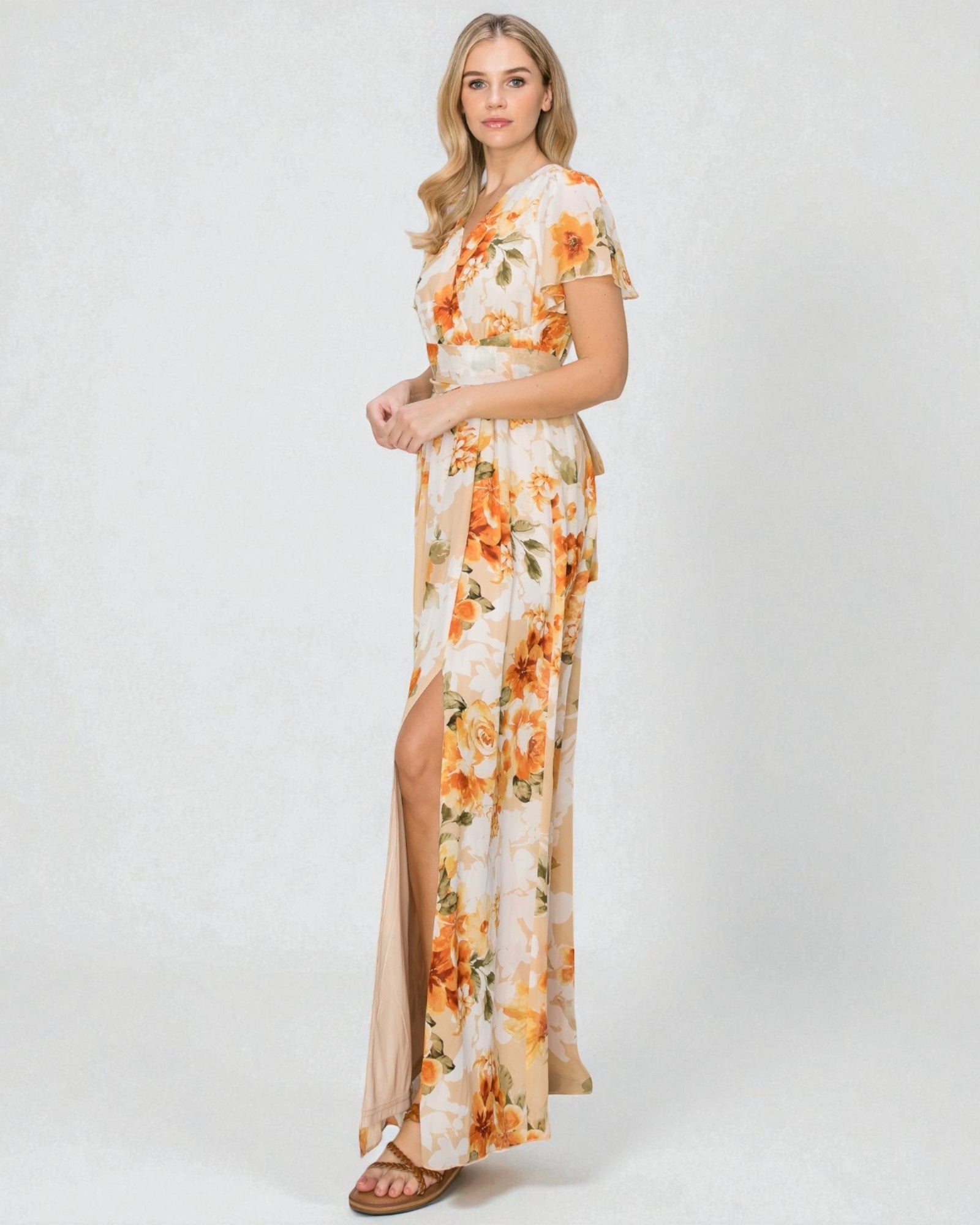 Woman wearing a floral dress with a white background