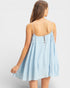 Light blue dress with thin straps and button details on a plain background