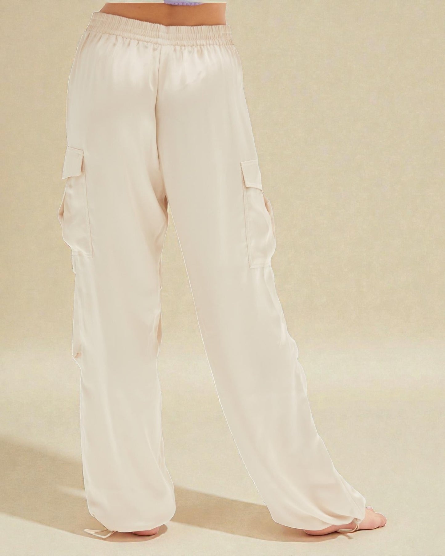 White cargo pants on a neutral background