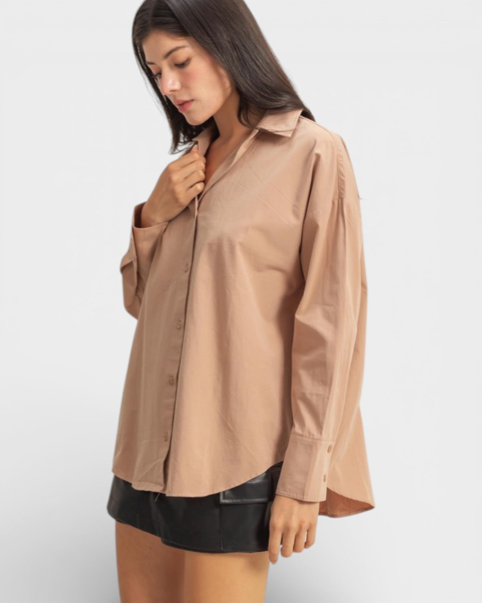 Woman wearing a beige shirt on a white background