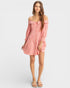 Woman wearing a pink off-shoulder dress on a white background