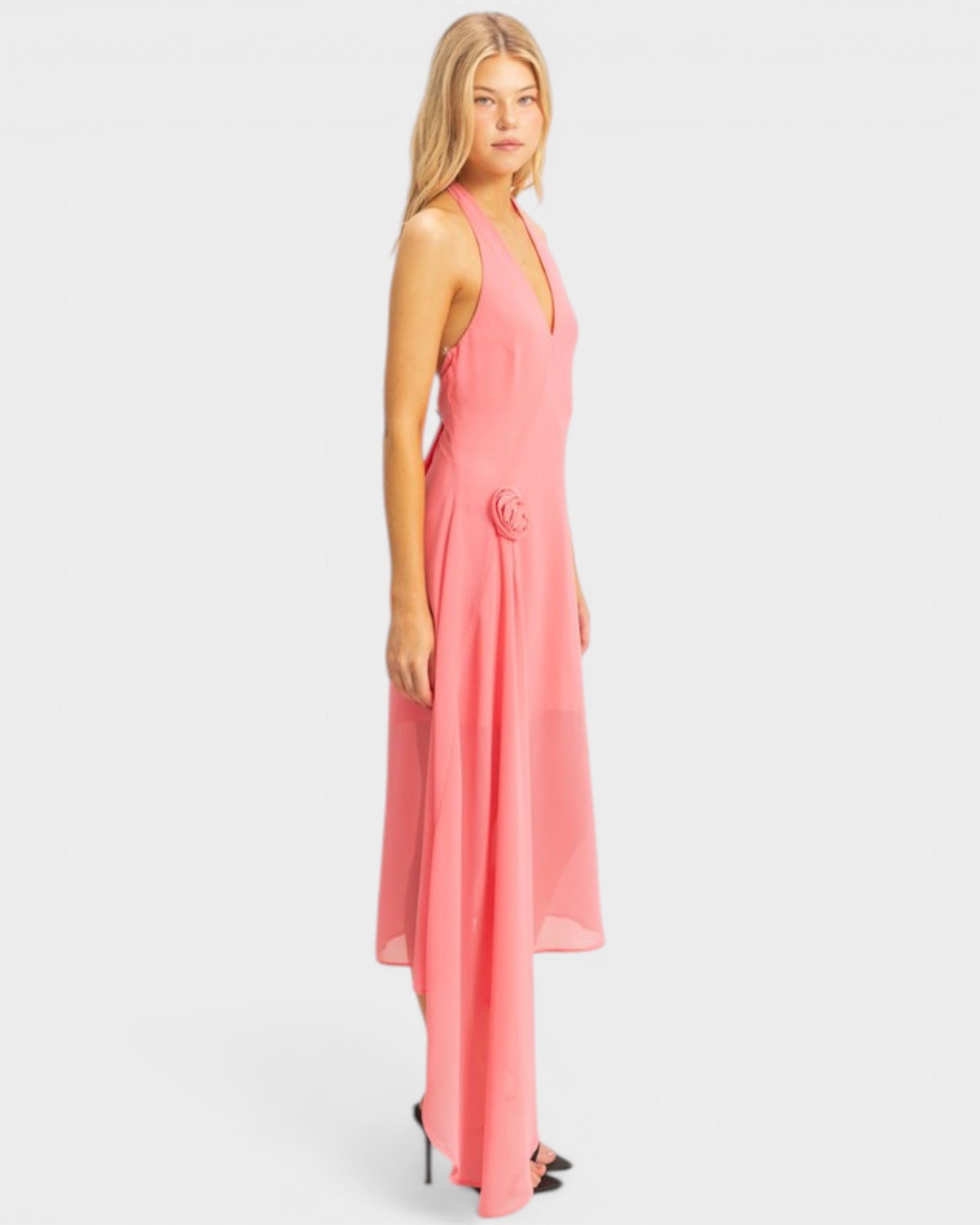 Woman wearing a pink dress on a white background