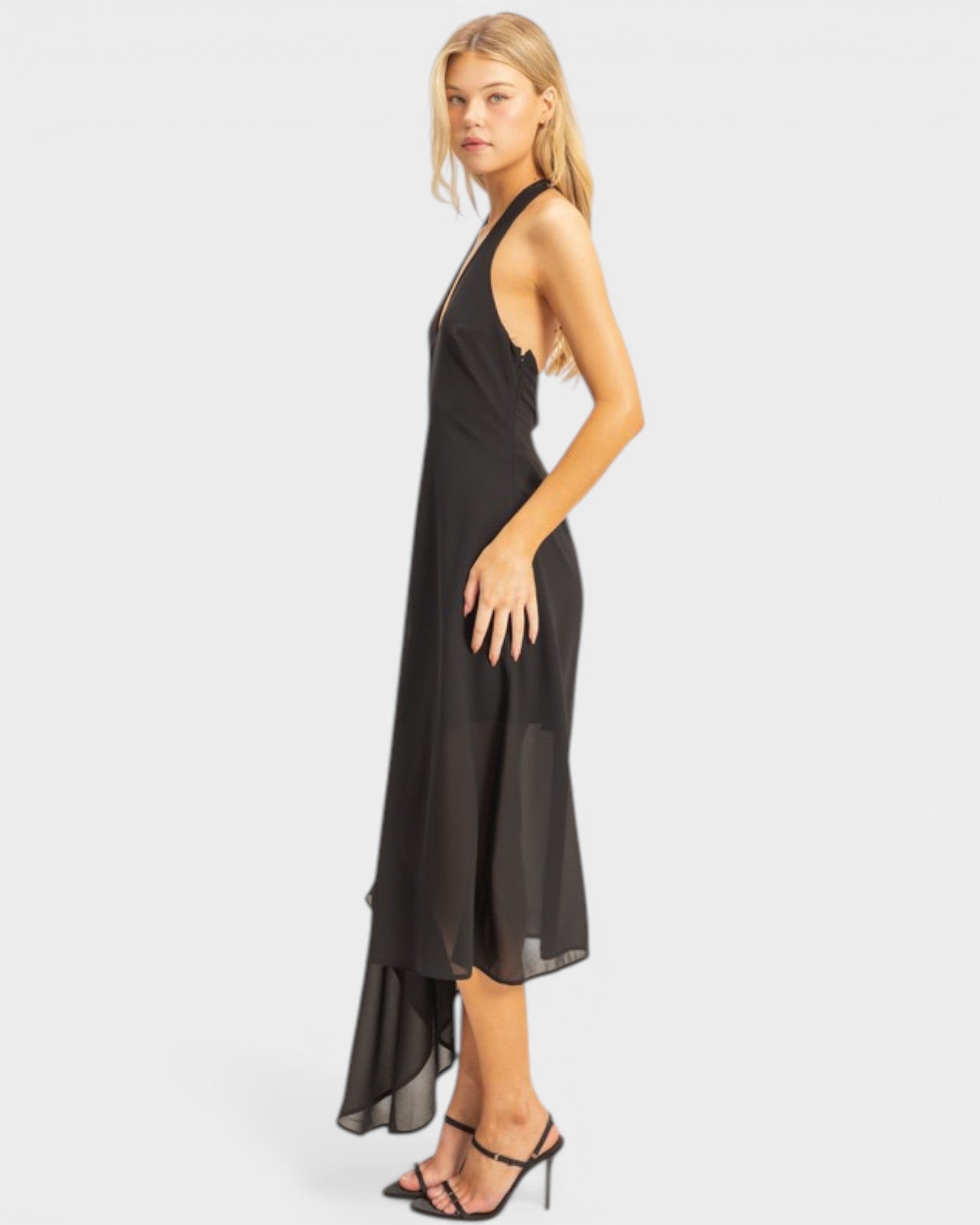Woman wearing a black dress on a white background
