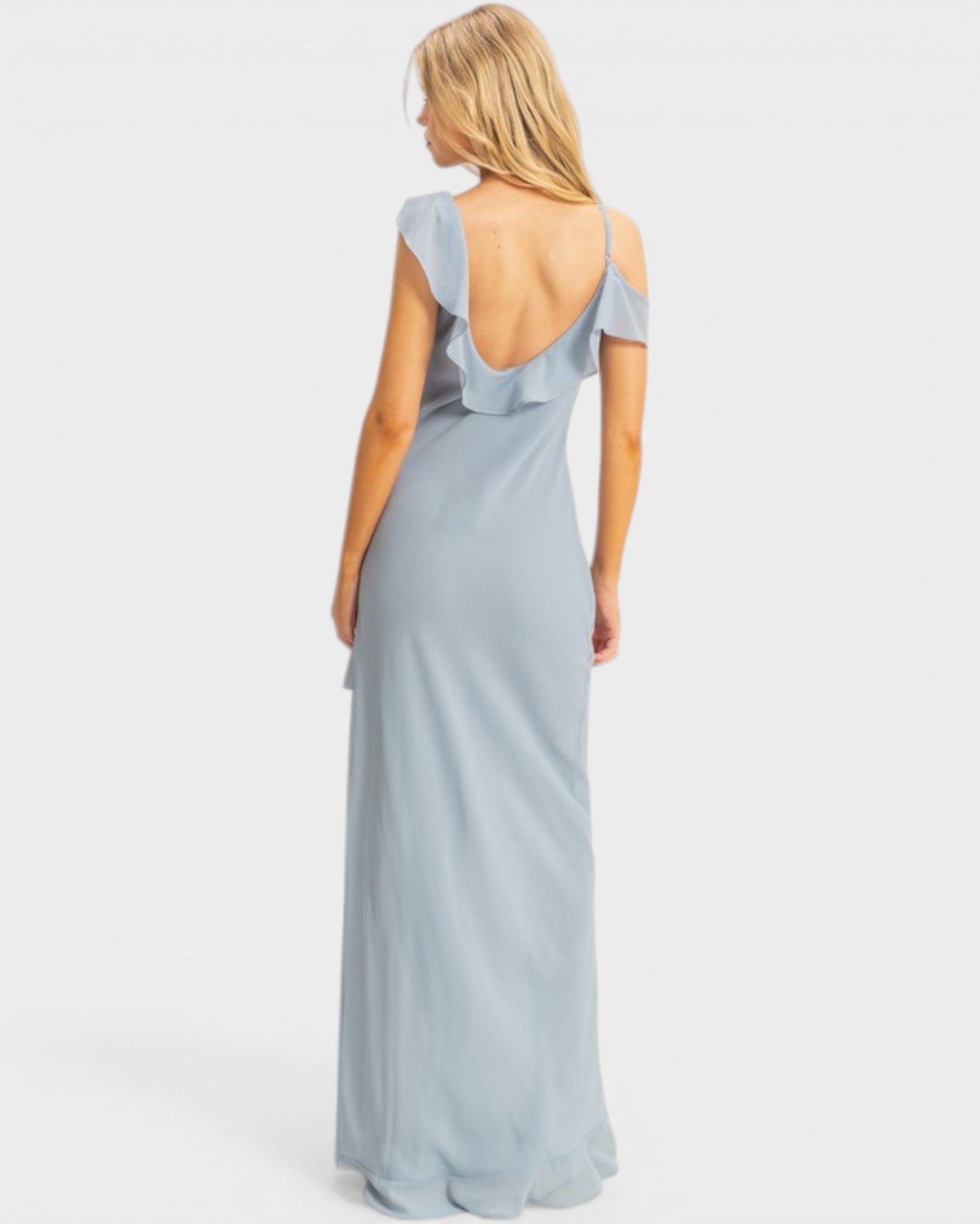 Woman wearing a light blue gown with a white background