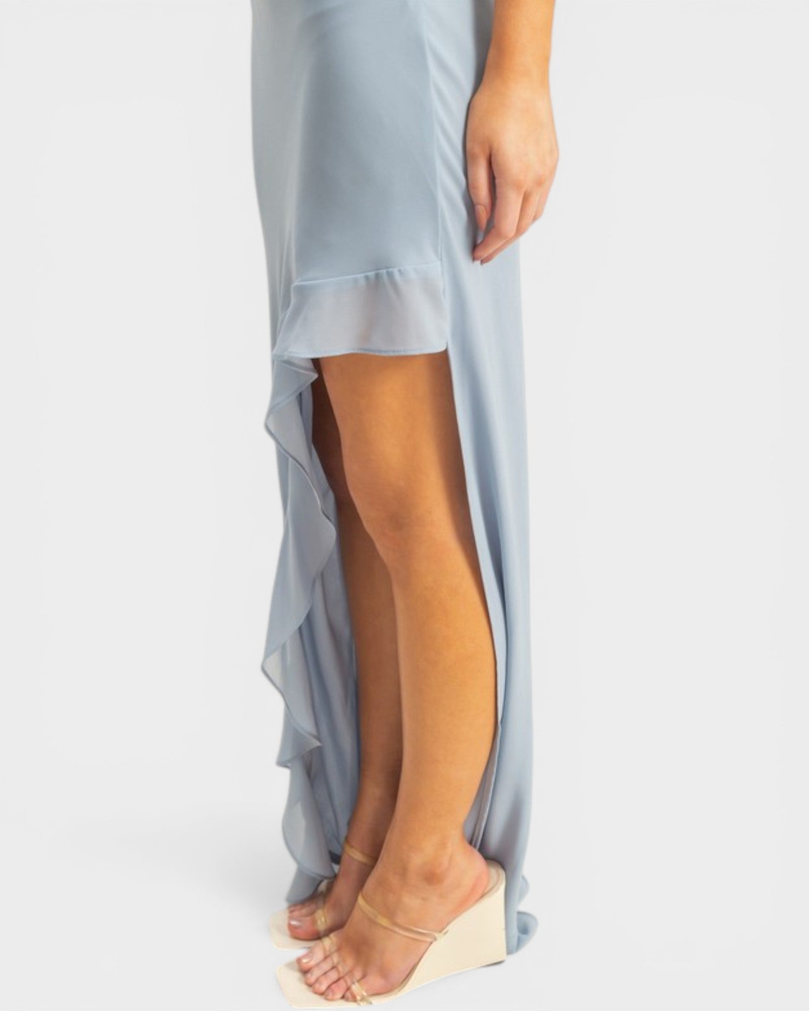 Light blue skirt with sheer overlay worn by a person on a white background