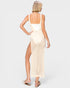 Woman wearing a white dress with a beige mesh skirt on a white background
