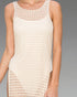 White mesh dress worn by a person on a gray background