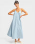 Woman wearing a light blue dress on a white background