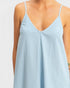 Light blue satin slip dress on a plain background
