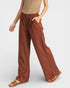Brown wide-leg pants worn by a person on a plain background