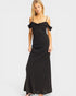 Woman wearing a black off-shoulder dress on a white background