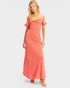 Woman wearing a coral off-shoulder dress on a white background
