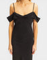 Black dress with ruffled straps on a white background