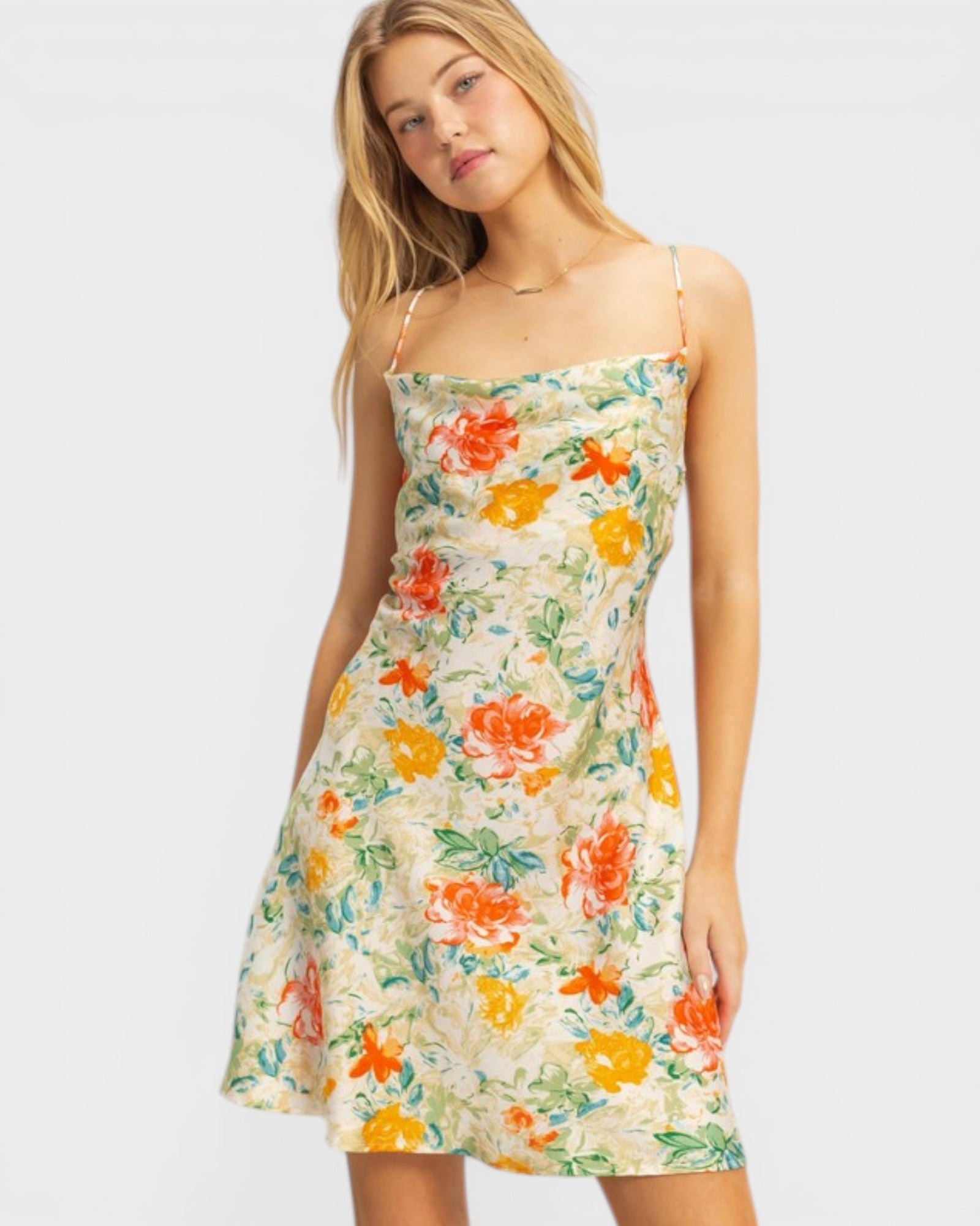 Woman wearing a floral dress on a white background