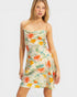 Woman wearing a floral dress with a plain background