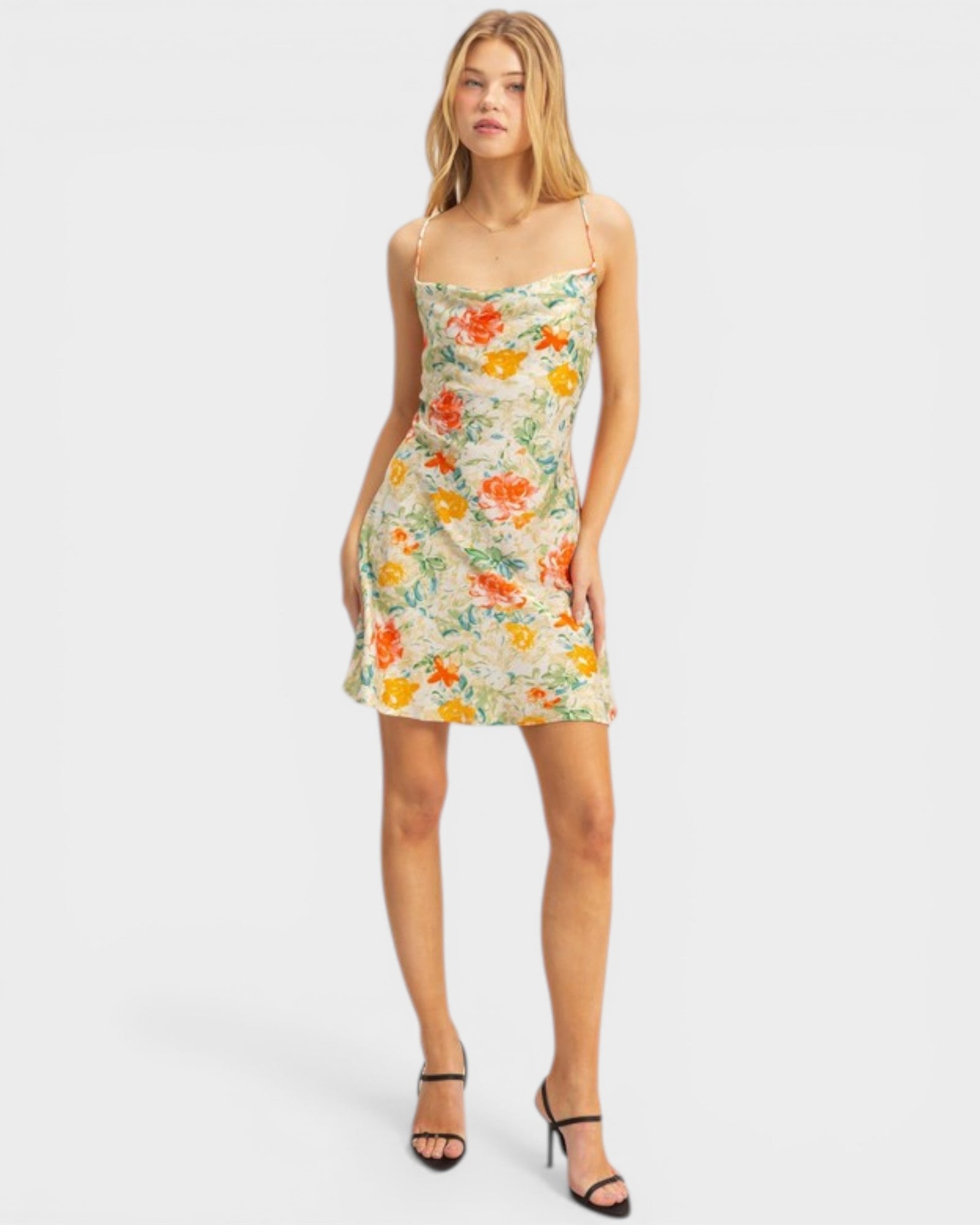 Woman wearing a floral dress on a white background