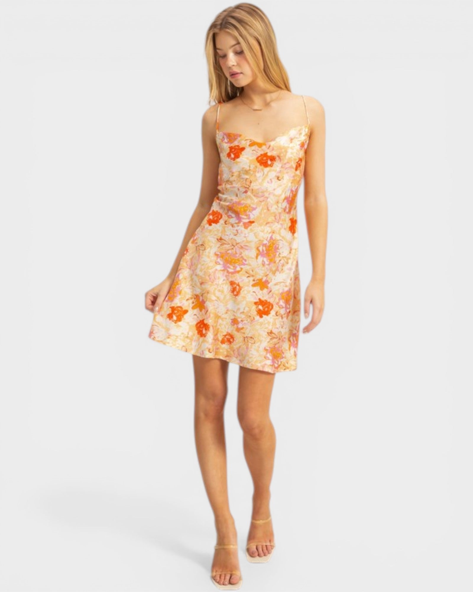 Woman wearing a floral dress on a white background
