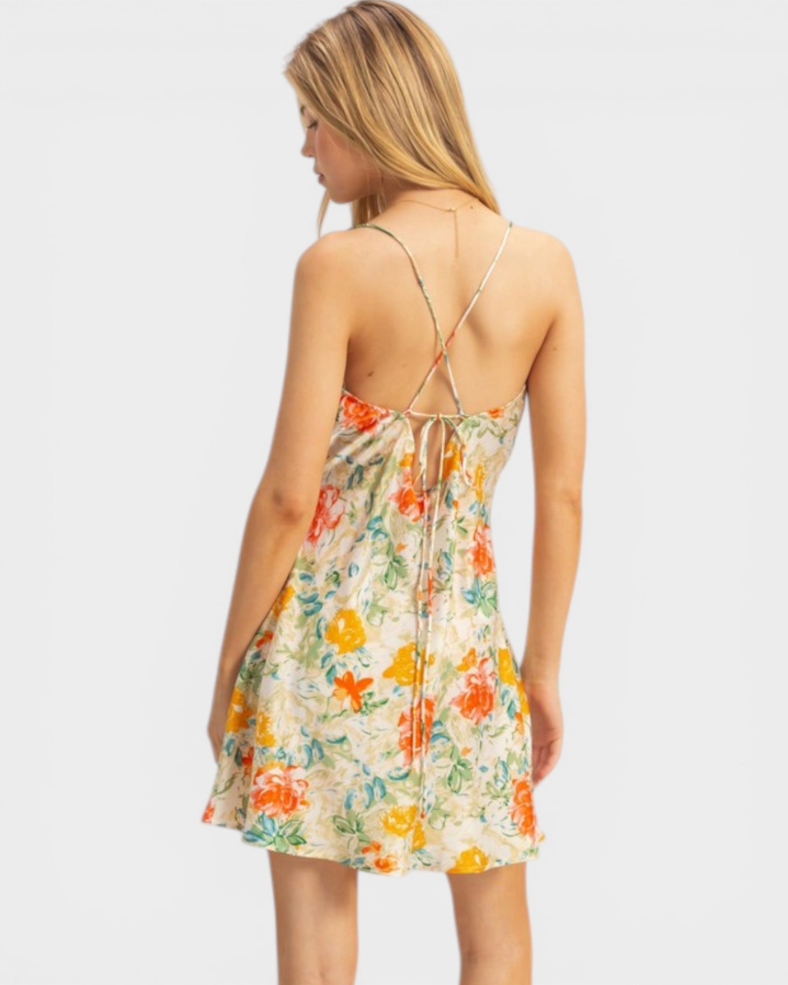 Woman wearing a floral dress on a white background