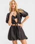 Woman wearing a black outfit with a white background
