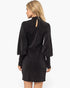 A woman shown from the back wearing a dark charcoal gray textured long-sleeve dress with a keyhole cutout at the neck, set against a plain white studio background.