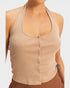 Beige ribbed tank top worn by a person on a white background
