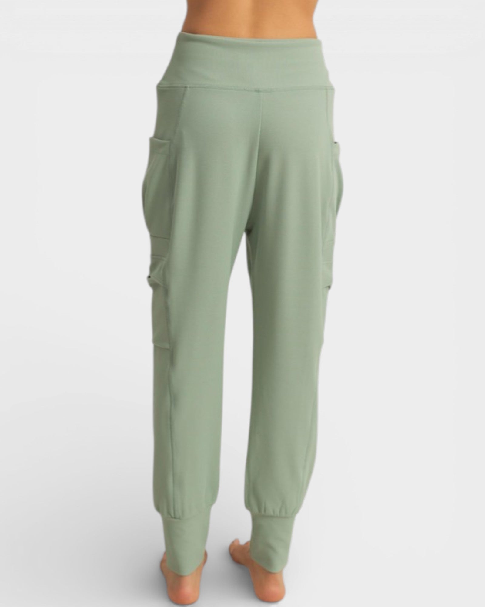 Green jogger pants on a white background