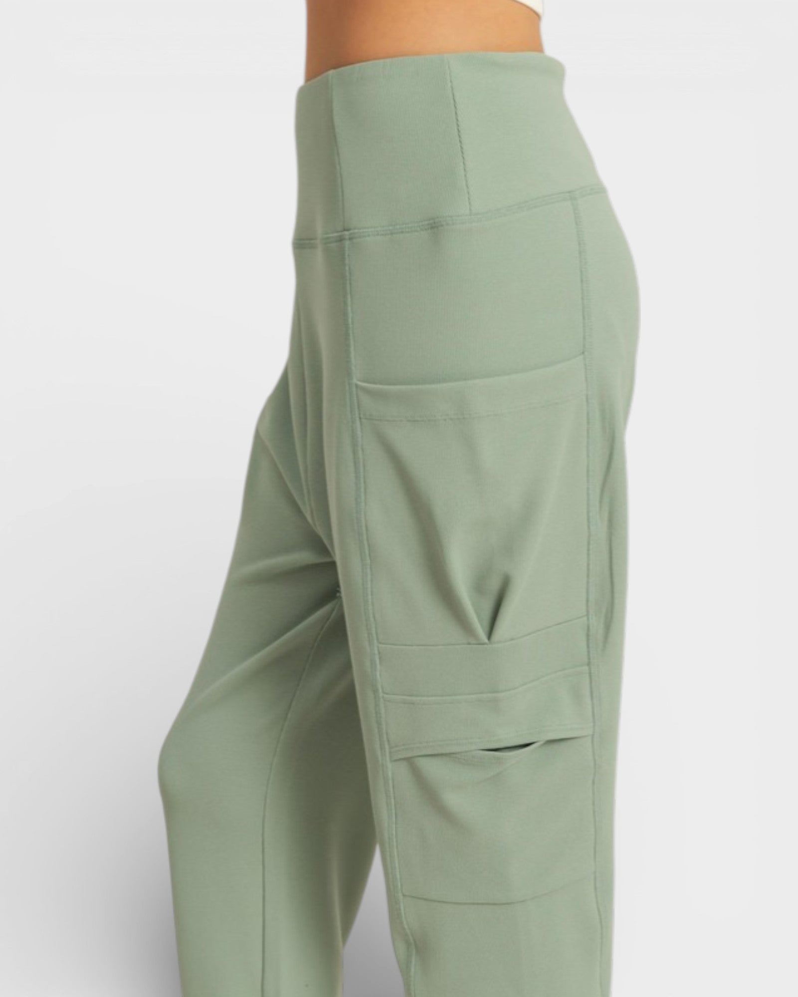 Green cargo pants on a white background