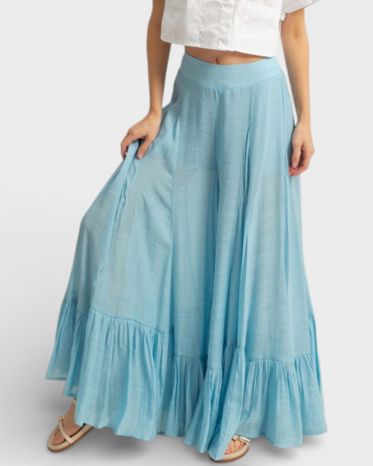 Light blue skirt with ruffled hem on a white background