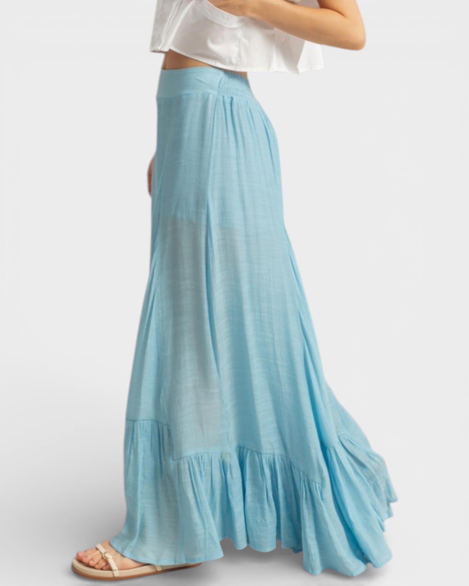 Light blue maxi skirt worn by a person on a white background